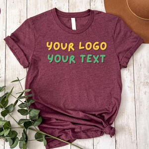 a t - shirt that says your logo is next to a hat