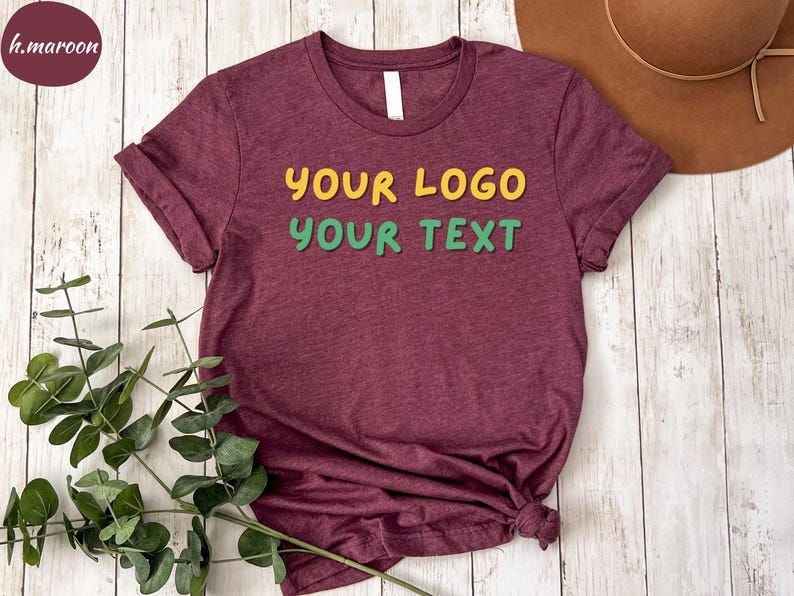 a t - shirt that says your logo is next to a hat