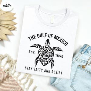 a t - shirt that says the gulf of mexico and a turtle on it