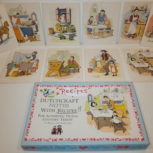 May include: A collection of vintage recipe cards and a matching box. The cards feature colorful illustrations of Dutch country scenes. The box reads "Recipes DUTCHCRAFT NOTES WITH RECIPES!!" and includes 12 notes and envelopes for authentic Dutch country treats.