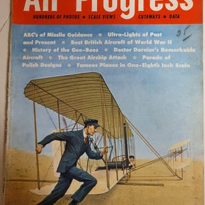 May include: A vintage magazine cover titled "Air Progress" from the Fall 1959 edition. The cover features a man running towards a biplane, with the magazine's title in large, bold letters. The cover also lists articles about aircraft.
