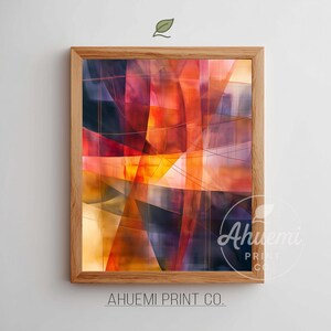 May include: Abstract art print in a wooden frame. The artwork features a vibrant composition of intersecting lines and shapes in shades of red, orange, yellow, and purple. The print is from Ahuemi Print Co.