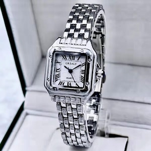 Reloj de cuarzo plateado para mujer | Esfera con números romanos | Caja cuadrada | Brazalete de acero inoxidable | Elegante reloj clásico