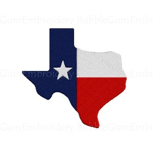 May include: An embroidered patch in the shape of the state of Texas with the Texas flag colors: blue, white, and red. The patch features a white star in the blue section of the flag.