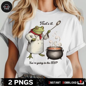 May include: White t-shirt featuring a cartoon frog chef with a red scarf, holding a spoon over a bubbling pot of soup. Text reads "That's it." and "You're going in the SOUP."