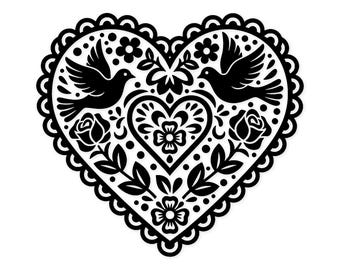 May include: A black and white heart-shaped design featuring two doves, roses, and floral elements. The heart has a scalloped border and intricate details, creating a symmetrical and decorative pattern. The design is suitable for various crafts and projects.