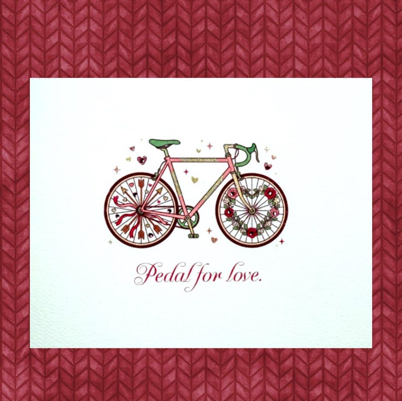 May include: A pink bicycle illustration with a green seat and handlebars, adorned with hearts and flowers. The wheels are decorated with arrows and a heart-shaped floral design. The text "Pedal for love" is written below the bicycle.