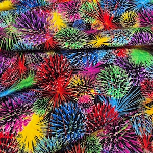 May include: A black fabric featuring a vibrant, all-over print of multi-colored fireworks or spiky floral bursts in shades of neon yellow, bright red, electric blue, vivid purple, and lime green, creating a dense and energetic visual pattern.