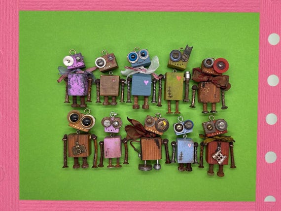 Tiny hand-assembled robots made from Soviet-era electronic components — little Cold War creatures you can clip to your bag or keys.