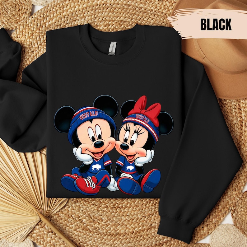 A black t-shirt with a graphic of two cartoon mice wearing New York Buffalo jerseys and hats, sitting next to each other.