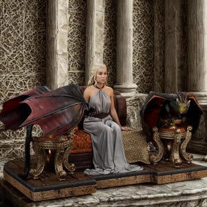 May include: A detailed figurine of a woman in a grey dress seated on a throne, flanked by dragon wings and a dragon statue. The throne is set on a wooden base with ornate gold accents, against a backdrop of stone columns.