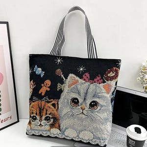 Adorable bolso de lona con cremallera y temática de gatos para amantes de la lectura y dueños de mascotas.