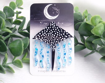 Stingray brooch. Black, white manta ray pin, quirky, fun swinging brooch. Aqua blue water and swinging tail.