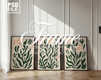 May include: Three framed art prints with abstract botanical designs in green and peach tones. The frames are black, and the artwork is displayed against a white wall. The text "Frame Mockup" is overlaid on the image, along with the "aurethia studio" logo.