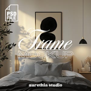 May include: A bedroom mockup featuring a bed with striped bedding and pillows. A framed artwork with black abstract shapes hangs above the bed. The image includes the text "Frame Mockup" and "aurethia studio".
