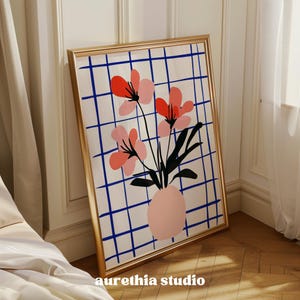 May include: A framed print of a stylized floral arrangement with pink and red flowers in a pink vase. The flowers are set against a blue and white checkered background.