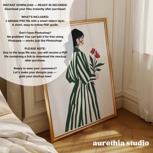 May include: A digital illustration of a woman in a green and white striped dress holding a bouquet of red flowers. The illustration is framed in gold and is leaning against a white wall. The text "aurethia studio" is visible in the bottom right corner of the image.
