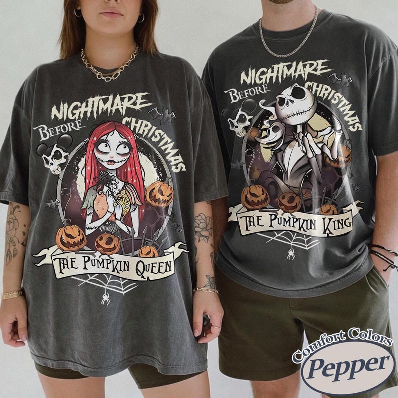 May include: Two charcoal gray t-shirts featuring characters from "The Nightmare Before Christmas." One shirt has Sally, pumpkins, and the text "The Pumpkin Queen." The other has Jack Skellington and the text "The Pumpkin King."