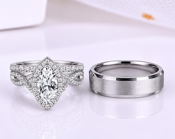 Puede incluir: Un anillo de compromiso plateado con una piedra central de corte marquesa rodeada por un halo de pequeñas piedras redondas en una banda trenzada, junto a una alianza lisa de plata cepillada con bordes biselados y acabado pulido.