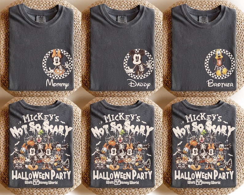 May include: Six charcoal gray t-shirts. Three shirts have a circular graphic with a character and the words "Mommy", "Daddy", and "Brother". The other three shirts have a Halloween-themed graphic with the text "Mickey's Not So Scary Halloween Party Walt Disney World".