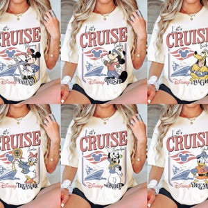 May include: Cream-colored t-shirts with a retro cruise design featuring Disney characters. Each shirt has the words "Let's Cruise" and a different character: Minnie, Mickey, Pluto, Daisy, Goofy, and Donald Duck. The shirts are a fun, casual style.