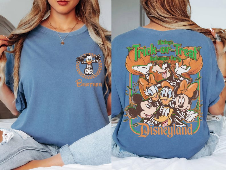 May include: A blue t-shirt featuring a small graphic of Donald Duck in a skeleton costume with the word Brother on the front. The back displays a large graphic of Mickey, Minnie, Donald, Daisy, and Goofy in skeleton costumes with the text Mickey's Trick-or-Treat Halloween Party and Disneyland.