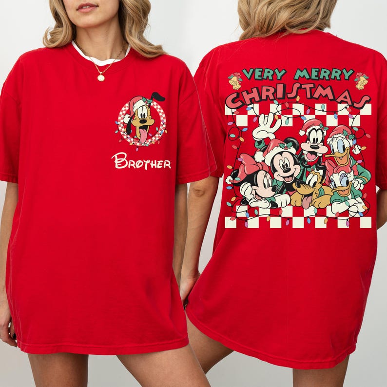 May include: Red t-shirt with a Christmas theme. The front has a cartoon dog in a Santa hat and the word "Brother". The back features Mickey, Minnie, Goofy, Donald, and Daisy Duck with the text "Very Merry Christmas".