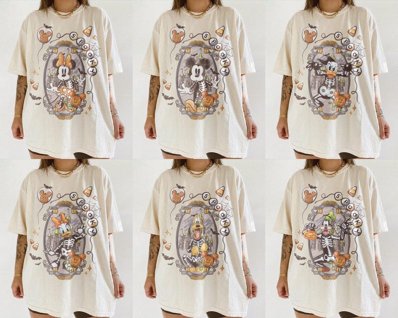 May include: Cream-colored Halloween t-shirts featuring various Disney characters as skeletons. Each shirt has a unique design within an oval frame, with candy corn and spooky accents. The shirts are oversized and have short sleeves.