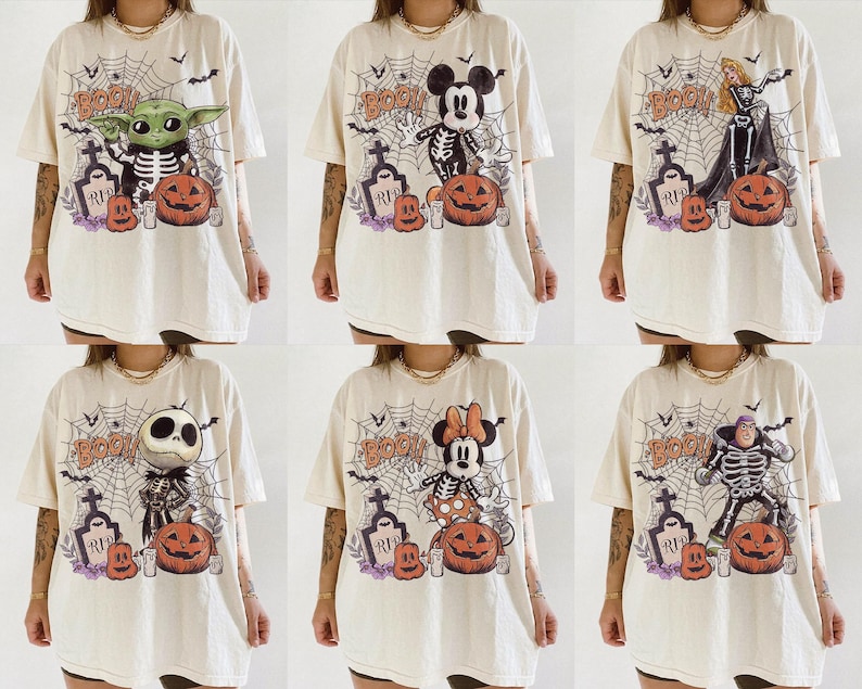 May include: A collection of six off-white t-shirts featuring various cartoon characters dressed in skeleton costumes. Each shirt displays a spiderweb background, a tombstone labelled RIP, a carved pumpkin, and the word BOO in orange lettering.