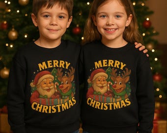 May include: Two children wearing matching black sweatshirts with a Christmas design. The design features Santa Claus and a reindeer with the words "MERRY CHRISTMAS" in gold lettering. The background is a Christmas tree.