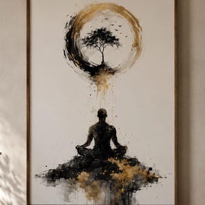 May include: A framed wall art print featuring a black and gold watercolor illustration of a person sitting in a meditative pose on a dark textured mound, positioned beneath a circular gold brushstroke containing a small tree and flying birds.