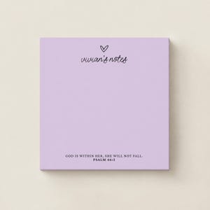 May include: A square light purple notepad featuring a small black heart icon above the text vivian's notes in a cursive font. At the bottom, the text reads GOD IS WITHIN HER, SHE WILL NOT FALL. PSALM 46:5 in a simple black sans-serif font.