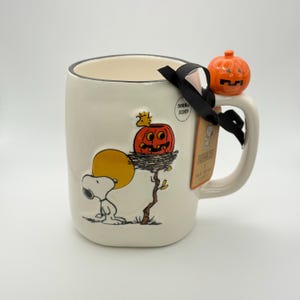 Snoopy and Woodstock Halloween mug by Rae Dunn | Snoopy spooky season Halloween mug with a ceramic Jack o lantern on the handle