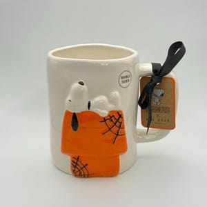 Snoopy Halloween mug by Rae Dunn | 3D Snoopy coffee mug | Snoopy resting on his iconic doghouse in fall colors | Caught in your web mug