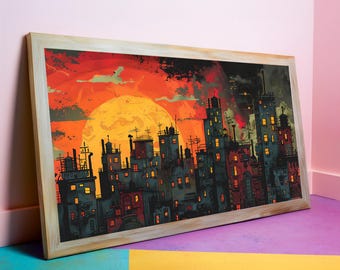 May include: A framed art print depicting a stylized cityscape under a vibrant orange and yellow sky. The buildings are dark with illuminated windows, and the artwork has a bold, graphic style. The frame is a light wood color.