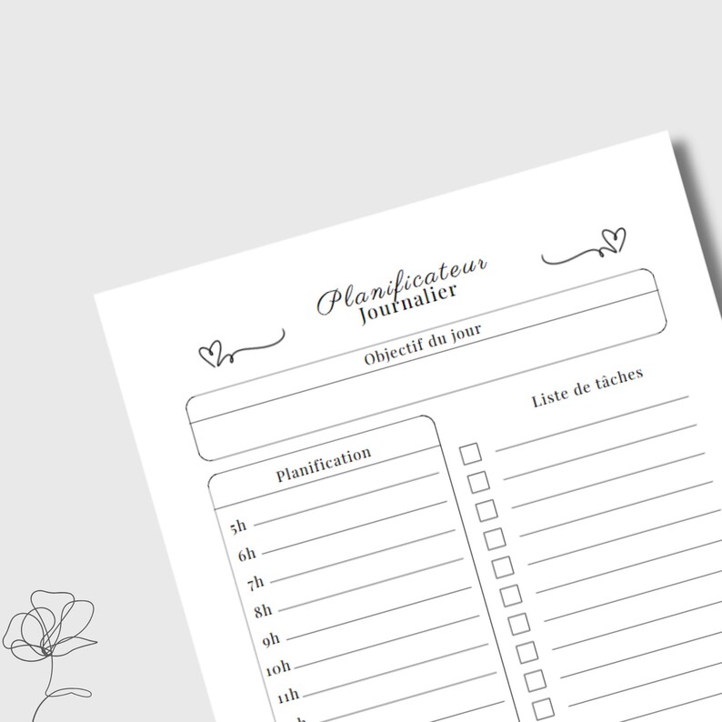May include: A white planner page with the words "Planificateur Journalier" and "Objectif du jour" at the top. It includes sections for daily planning and a task list, with time slots from 5h to 11h. Decorative hearts and a floral sketch are also present.