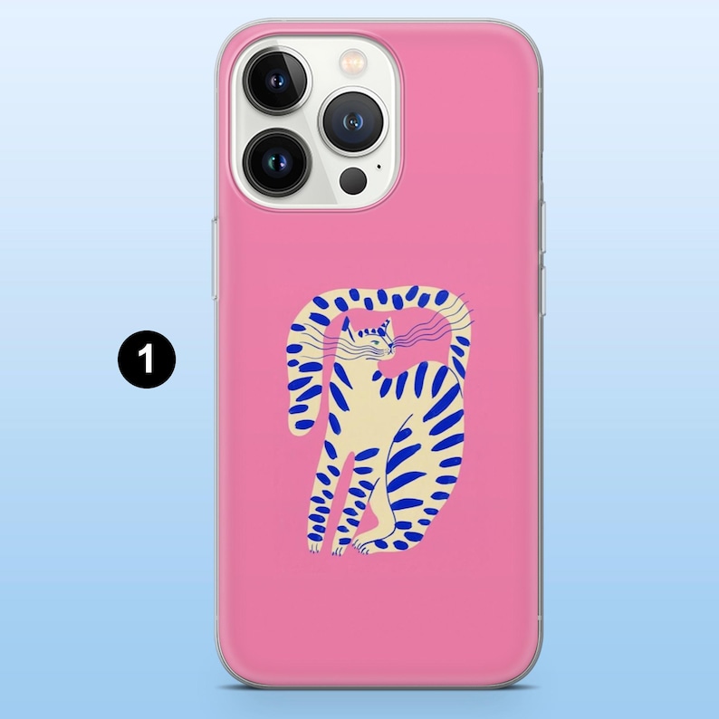 May include: A pink phone case featuring a whimsical illustration of a cat with blue stripes and a curved tail. The cat is set against a solid pink background. The case is designed to fit a smartphone.
