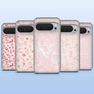 May include: Five phone cases with pink and white patterns, including floral and animal prints. The designs feature a leopard print, roses, and large floral outlines. The cases are displayed in a row, showcasing the variety of designs.