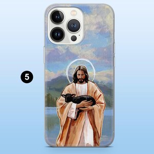 May include: Clear phone case featuring a painting of Jesus holding a black lamb. The artwork has a halo around Jesus's head and is set against a backdrop of a lake and mountains. The case has a number 5 in a black circle.