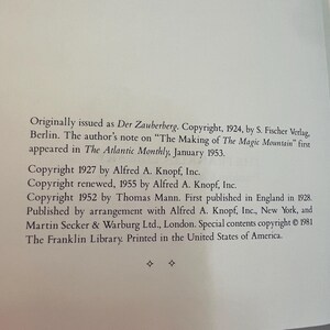 May include: A page from a book with text detailing copyright information. The text includes the original publication details of "Der Zauberberg" and "The Making of The Magic Mountain", along with copyright dates and publisher names.