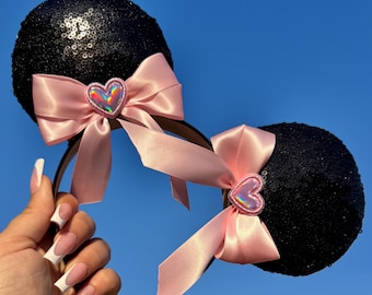 Orecchie di topo nere scintillanti con doppi fiocchi rosa