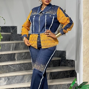 May include: A denim jacket and matching pants set. The jacket features yellow lace sleeves and a yellow lace panel on the front. The jeans have white trim and are embellished with rhinestones. The outfit is a stylish ensemble.