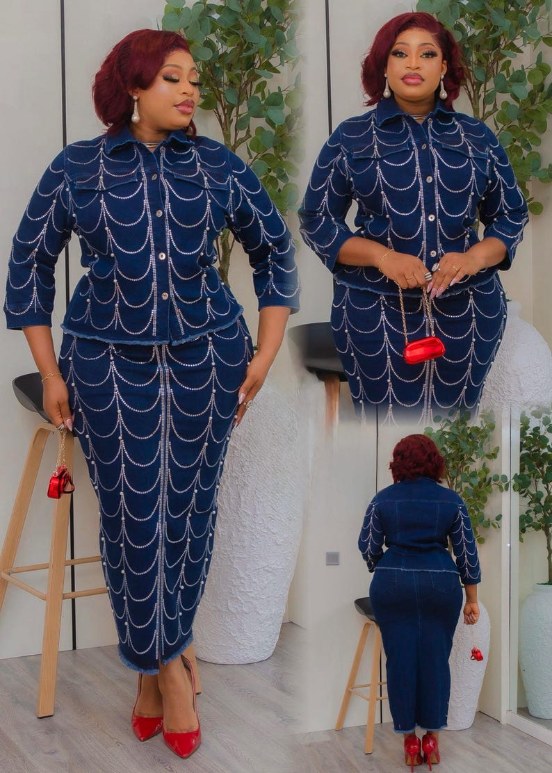 May include: A dark blue denim jacket and skirt set. The jacket has a collared neckline and long sleeves. The skirt is a pencil skirt. Both pieces are embellished with a white pearl design. The outfit is paired with red heels and a small red purse.