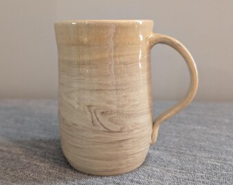 Handmade Beige Pottery Mug with Swirl Glaze, Signed "Tathlina Lovlin"