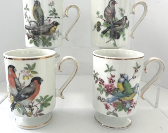 Juego de 4 tazas Royal Crown Bird con asa dorada clásica para mesa.