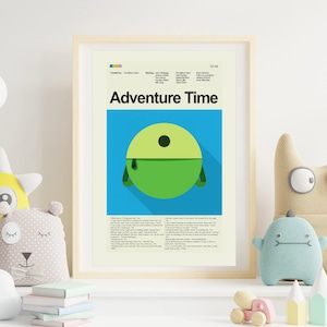 May include: A framed poster featuring the text "Adventure Time" above a green and yellow cartoon character on a blue background. The poster has a light wood frame and is surrounded by children's toys.