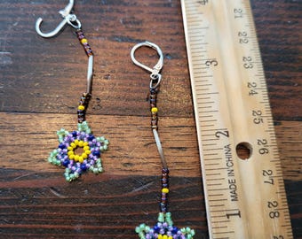 Pendientes nativos hechos a mano con púas de puercoespín de origen ético en patrón de estrella.