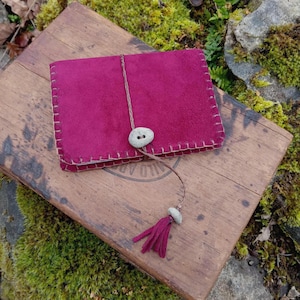 Small hand stitched leather notebook with  Oregon river stone button and tassel closure. (Refillable)