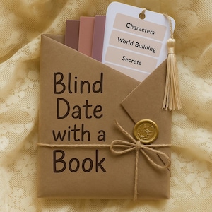 May include: A brown paper package tied with twine, sealed with a gold wax stamp, and labeled "Blind Date with a Book." Inside are several colored bookmarks and a tag listing "Characters," "World Building," and "Secrets."