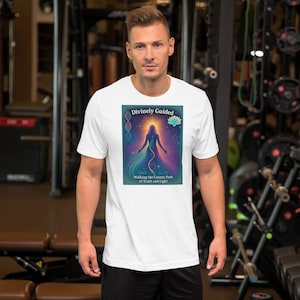 May include: White t-shirt featuring a colourful graphic design of a woman standing with a glowing aura. The graphic includes the text "Divinely Guided" and "Walking the Cosmic Path of Truth and Light".